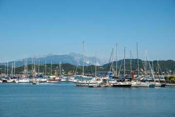Fototapeta na wymiar La Spezia port, Liguria, Italy. View on the sea and and mountain. yacht and boats in the port.