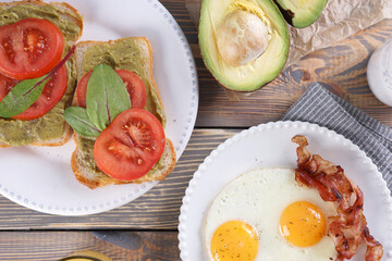 Breakfast with fried eggs and bacon and sandwiches with guacamole sauce