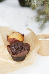 Chocolate and vanilla muffins in paper wrapper