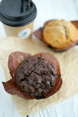 Chocolate and vanilla muffins in paper wrapper