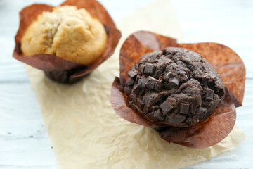 Chocolate and vanilla muffins in paper wrapper
