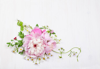 Fototapeta na wymiar Bouquet of beautiful flowers on white wooden background. Top view. Copy space