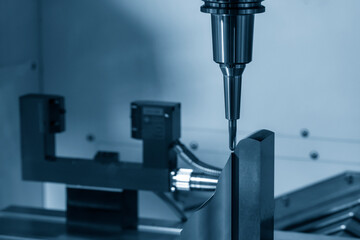 The  CNC  milling machine cutting  the mold parts by solid ball  end-mill tool. The hi-precision mold and die manufacturing concept by machining center.