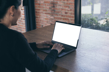 computer screen blank mockup.hand woman work using laptop with white background for advertising,contact business search information on desk at coffee shop.marketing and creative design