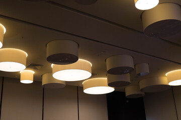 round lamps for room lighting, hanging from the ceiling