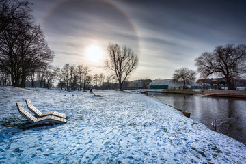 Halo effect around the sun in the winter park, Pruszcz Gdanski. Poland