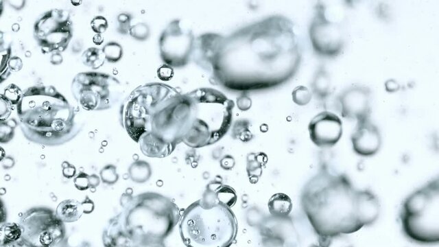 Super Slow Motion Shot of Moving Bubbles on White Background at 1000fps