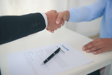Partner Business  signing contractpaper  for service and law, 
Business owners shake hands to agree to work.Partners hold hands to accept work.Businessman feedback document concept