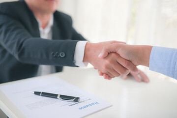 Partner Business  signing contractpaper  for service and law, 
Business owners shake hands to agree to work.Partners hold hands to accept work.Businessman feedback document concept