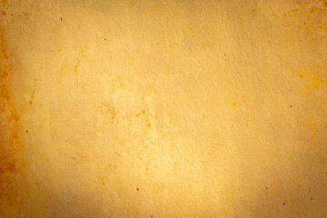 Old concrete wall painted gold color.
