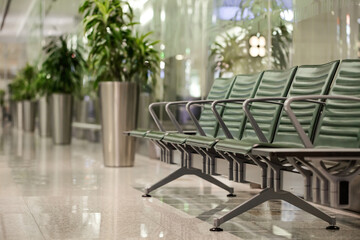 Empty seats in airport terminal interior. Departure area