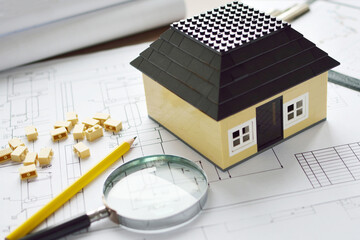 House model from the designer on the drawings. Business and construction.