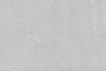 Cardboard gray texture close-up. Light old paper background. Grunge concrete wall. Vintage blank wallpaper.