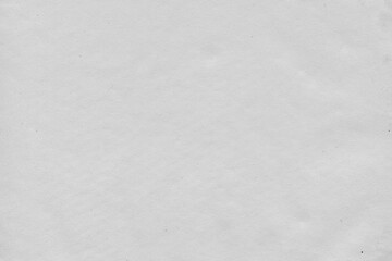 Cardboard gray texture close-up. Light old paper background. Grunge concrete wall. Vintage blank wallpaper.