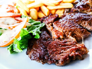 Juicy steak, beef meat with tomato and french fries