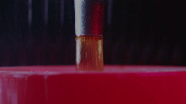 Close-Up machine Brewing Coffee In A red Mug