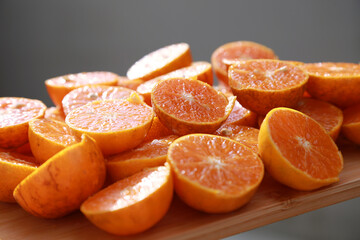 Fototapeta na wymiar sliced orange on wooden table