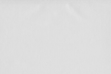 Cardboard gray texture close-up. Light old paper background. Grunge concrete wall. Vintage blank wallpaper.