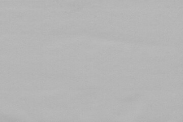 Cardboard gray texture close-up. Light old paper background. Grunge concrete wall. Vintage blank wallpaper.