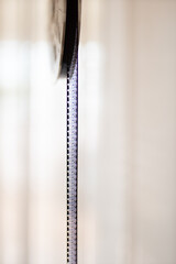 Isolated 8mm projector. Antique video technology. Old retro machine for films. Negative filmstrip