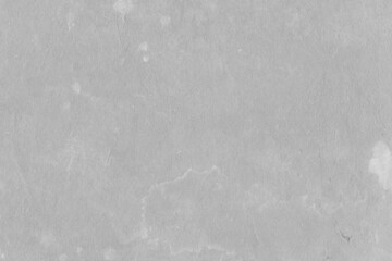 Fototapeta premium Cardboard gray texture close-up. Light old paper background. Grunge concrete wall. Vintage blank wallpaper.