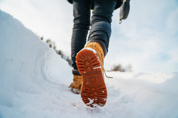 detail of hiker shoes during the winter walk