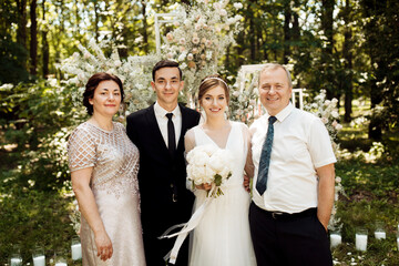 the newlyweds are photographed with family and friends. large group of people. A beautiful bride...