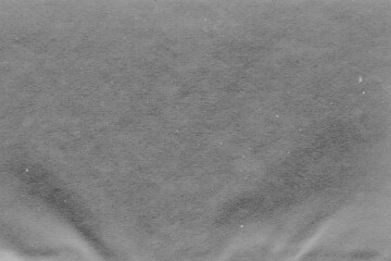 Naklejka premium Cardboard gray texture close-up. Light old paper background. Grunge concrete wall. Vintage blank wallpaper.