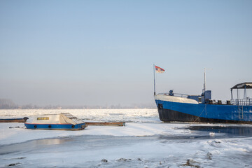 Cargo ship and a boat trapped on Frozen Danube during the 2017 winter, in Zemun, Belgrade, Serbia...