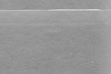 Fototapeta premium Cardboard gray texture close-up. Light old paper background. Grunge concrete wall. Vintage blank wallpaper.