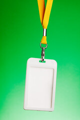 Badge for identification with the name and a yellow cord, empty space for text.