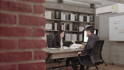 Business couples discussing in the office
