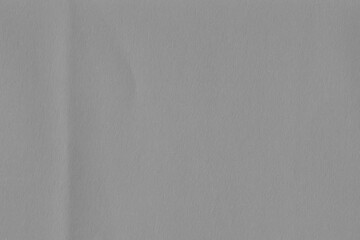 Cardboard gray texture close-up. Light old paper background. Grunge concrete wall. Vintage blank wallpaper.