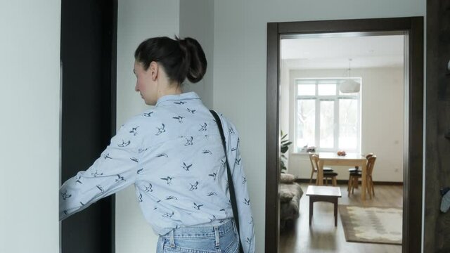 Woman using smart home security system
