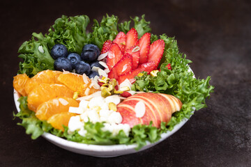 Fruit berry salad with almonds and sprouts