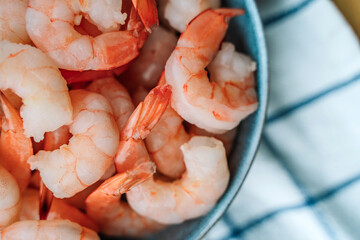 Peeled shrimps in a bowl, macro view