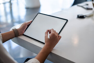 Business woman look at tablet computer and check office work.