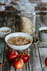 A porridge bowl with apples and cinnamon, food still life, healthy breakfast