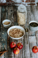 A porridge bowl with apples and cinnamon, food still life, healthy breakfast