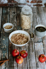 A porridge bowl with apples and cinnamon, food still life, healthy breakfast