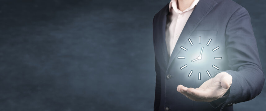 Businessman hold time. Businessman hand holding clock, Business time management and business plans concepts. blue background, banner, copyspace