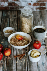 A porridge bowl with apples and cinnamon, food still life, healthy breakfast