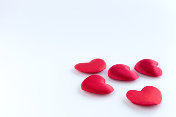 Red hearts on white background for Valentines day. Copy space.