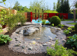 Ornate gardens with a pond and garden decorations.