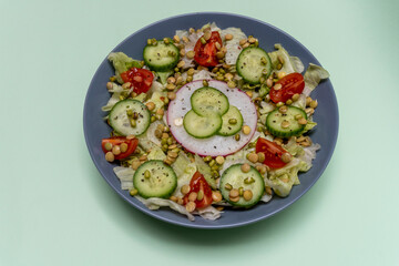 Beautiful vegetarian healthy raw salad from cabbage tomato cucumber  lentil sprouts and mung bean sprouts