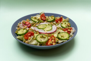 Beautiful vegetarian healthy raw salad from cabbage tomato cucumber  lentil sprouts and mung bean sprouts