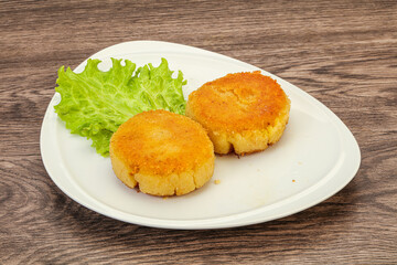 Vegan cuisine - Potato cutlet in the plate