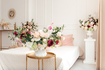 flowers in a vase in white bedroom