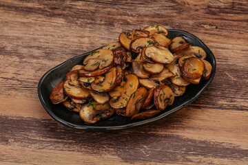 Roasted champignon with herbs and spices