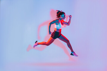 Fototapeta na wymiar Beautiful fit woman making sport and running